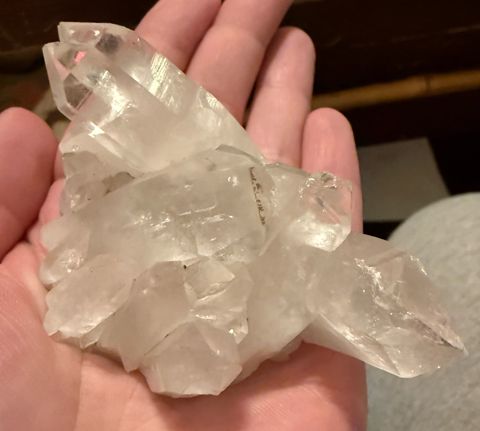 Clear Arkansas quartz cluster in hand