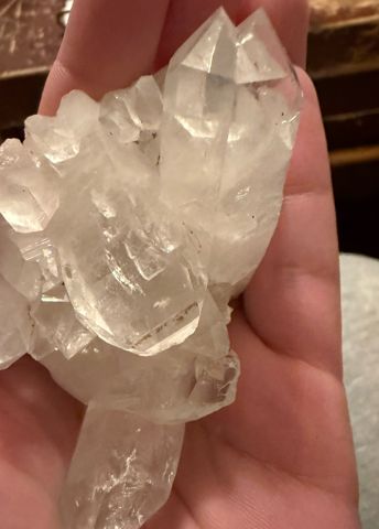 Clear Arkansas quartz cluster in hand
