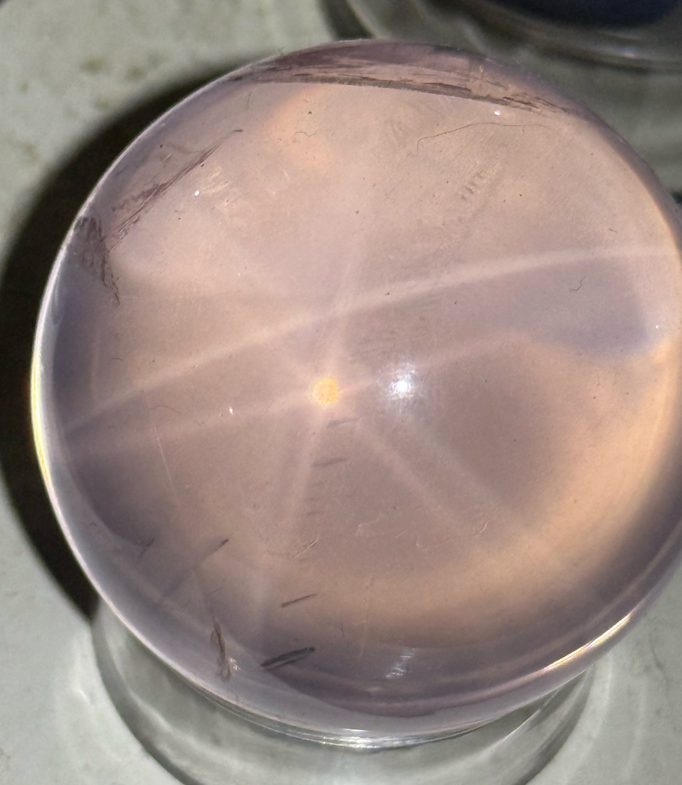 Star rose quartz sphere showing a six-rayed star